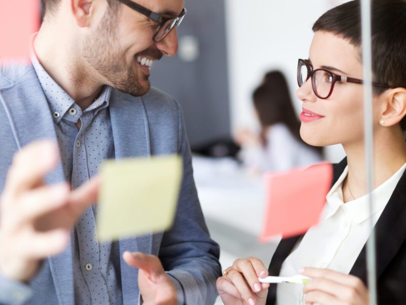 Business people having fun and chatting at workplace office